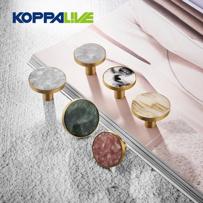 https://www.koppalive.com/top-quality-modern-single-hole-furniture-cupboard-solid-brass-kitchen-cabinet-drawer-shell-knob-product/